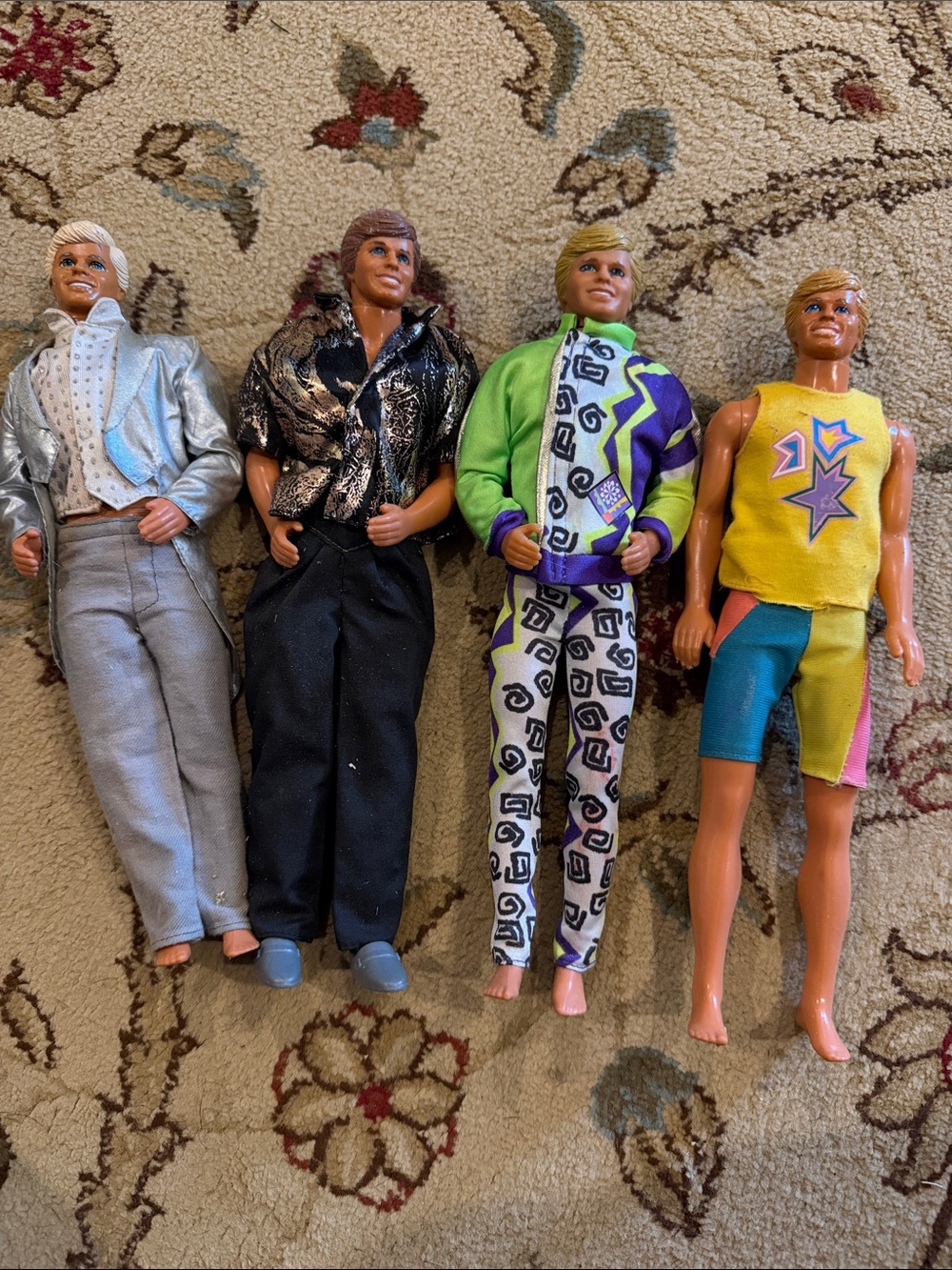 Lot of 4 Vintage Ken Dolls with Colorful Outfits - Silver, Black, Green, Yellow